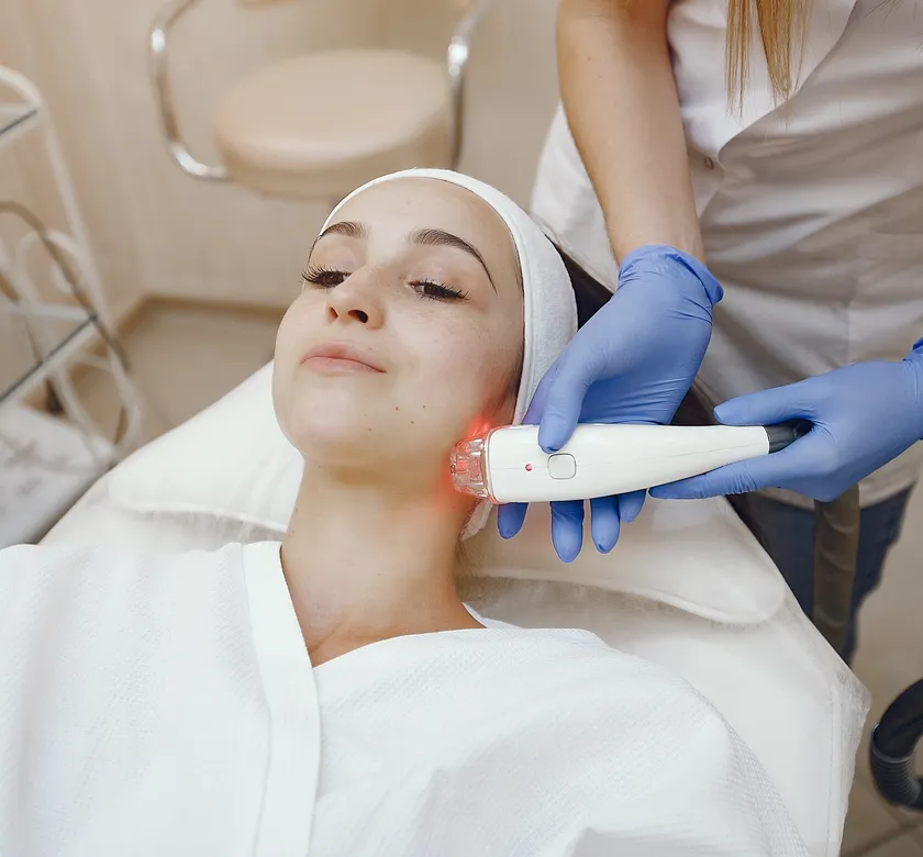 Laser provider treating a client in a modern clinic in St. Petersburg FL